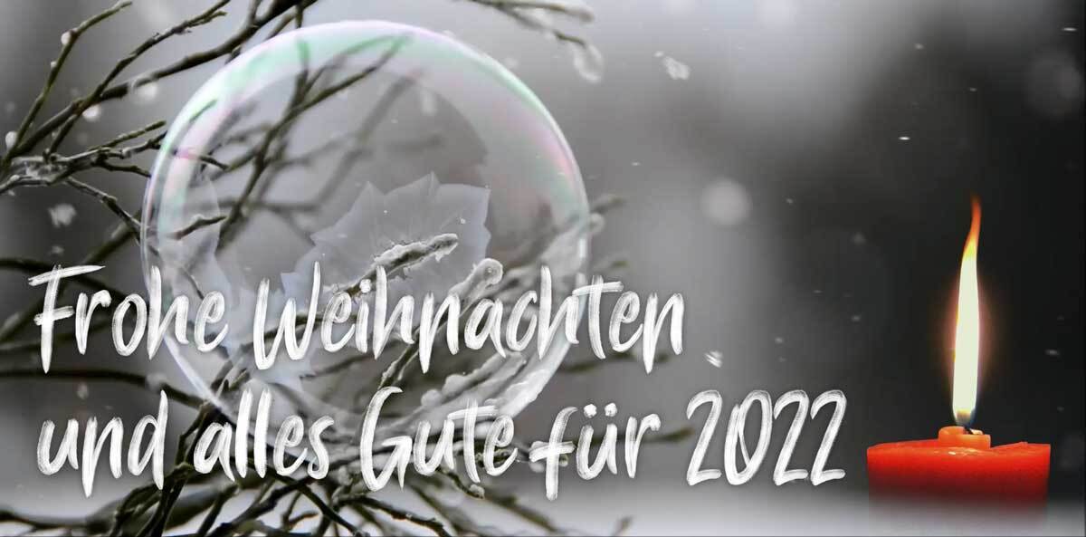 Weihnachtskerze und Schneeflocken. Foto: Luis Ulloa
